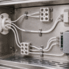 UL 1180 PTFE Wire for High-Temperature Electronics UL 1180 PTFE wire routed between electronic components and ceramic terminals in a thermal enclosure