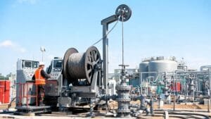 Wireline winch unit with mono conductor armored wireline cable deployed at oil and gas wellsite for logging operation