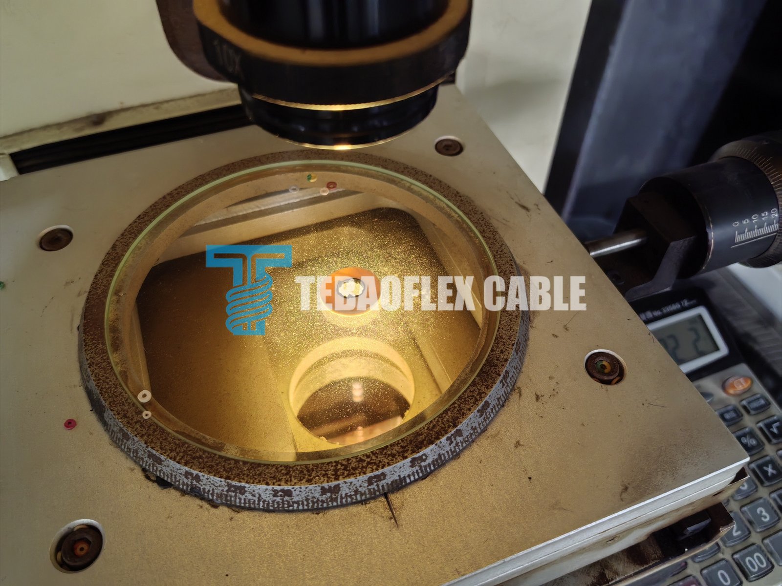 Technician measuring the insulation thickness of an (N)TSCGECEWOEU medium-voltage cable core