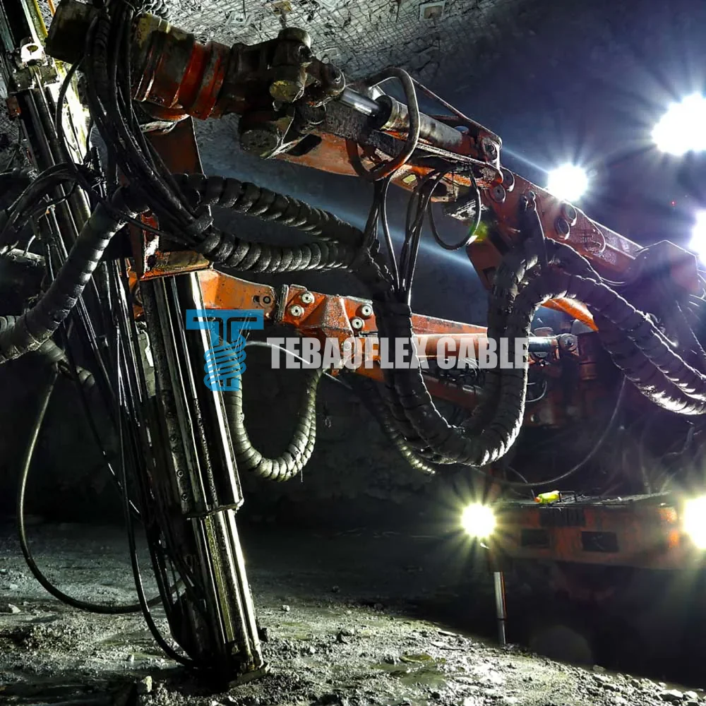 Underground drill cable routing where protective earth continuity and mechanical protection must be considered